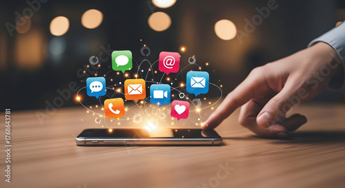 Smartphone on a desk with glowing app icons floating above