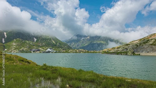 Time lapse, view on a small natural lake with mountains on the background. Totensee, Grimsel Pass, Canton Bern, Switzerland.