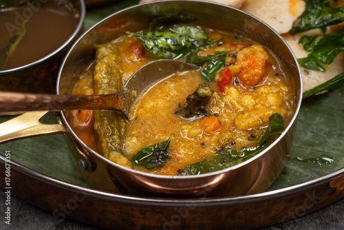 Close up of moringa and bitter gourd sambar: South Indian spicy lentil stew