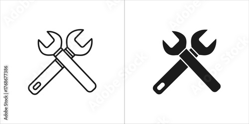 Two icons of crossed wrenches, one outline and one filled
