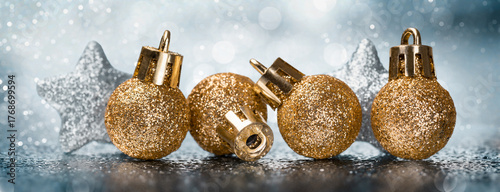 Fotografie Golden baubles with silver stars Christmas background