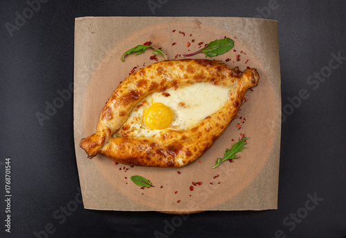 Adjarian khachapuri is a Georgian dish shaped like an open boat filled with several types of cheese.