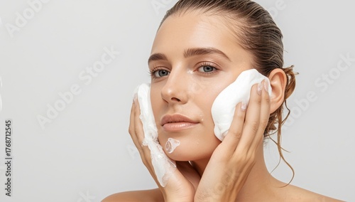 Woman Performing Skincare Routine With Foam Cleanser in Bright Setting