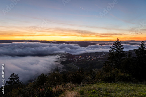Sunrise over the Rhine River near Bad Salzig in Germany creates a breathtaking view with fog and colorful skies