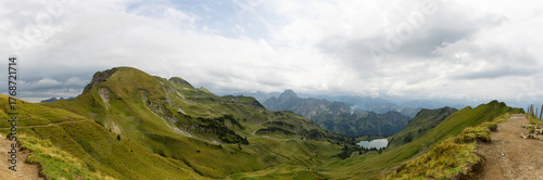 Stunning panoramic view of Nebelhorn in the German Alps showcasing lush landscapes and serene lakes on a cloudy day