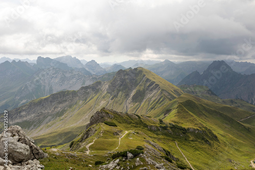 Stunning view of Nebelhorn peaks surrounded by clouds in the German Alps during summer hike