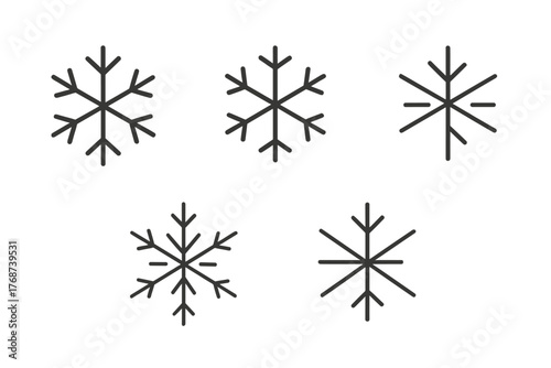 Set of five simple snowflake designs in black and white