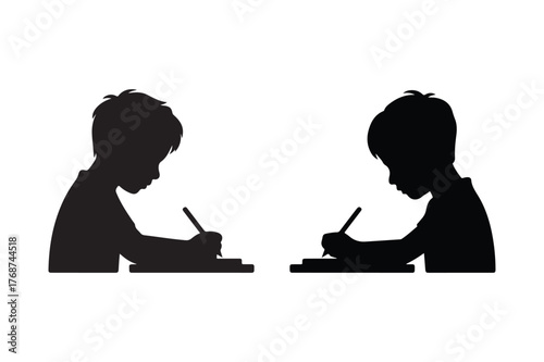 Two silhouetted children focused on writing at desks