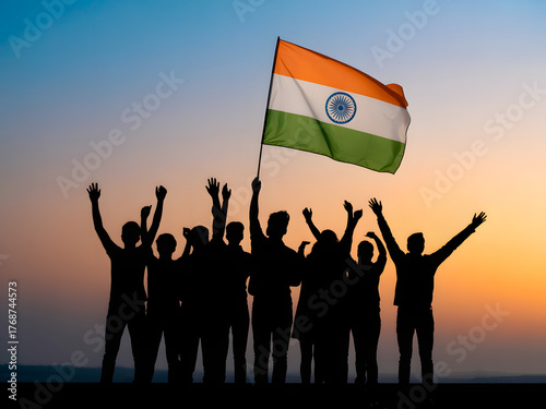 indian flag hoisting and celebration with silhouettes of people at sunset