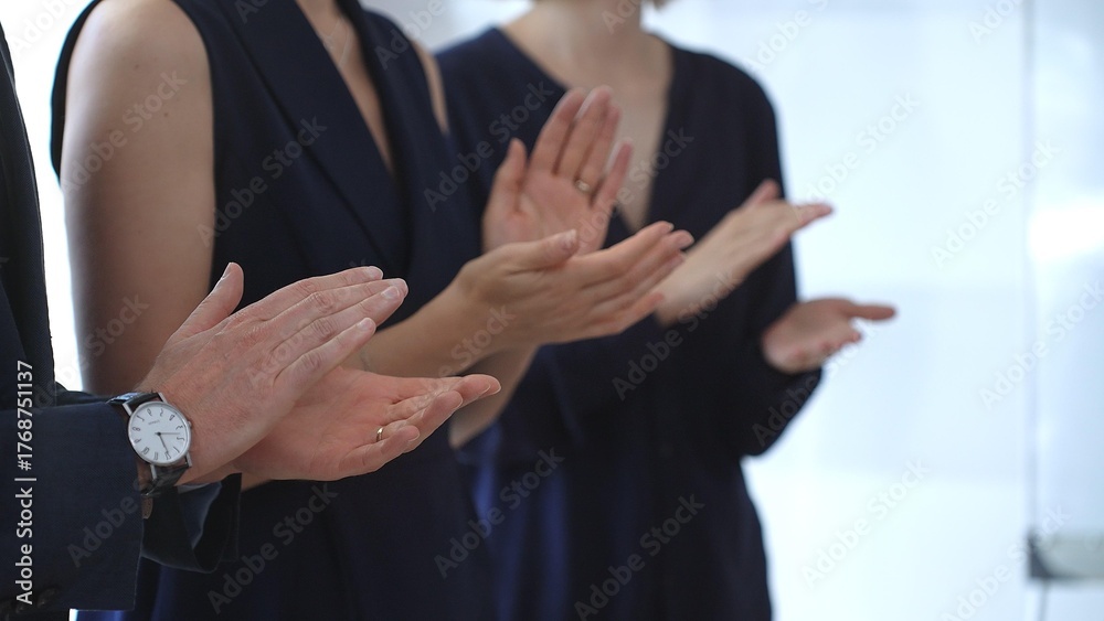 Fototapeta premium Group of business people clapping hands celebrating achievement, showing appreciation and support during a corporate meeting or seminar at a bright office conference