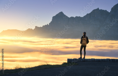 Woman with yellow backpack ...