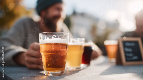 Craft beer tasting with diverse brews. Friends enjoying a flight of beer, celebrating friendship, relaxation. Perfect for food, drink, or lifestyle concepts.