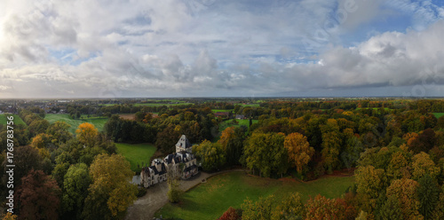 A breathtaking panoramic drone view of Kasteel van Westmalle, Belgium, captured in October 2025 just after a gentle autumn rain