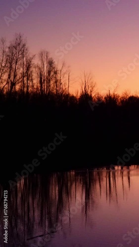 Golden Sunset Over Calm Lake as the Sun Slowly Sets
