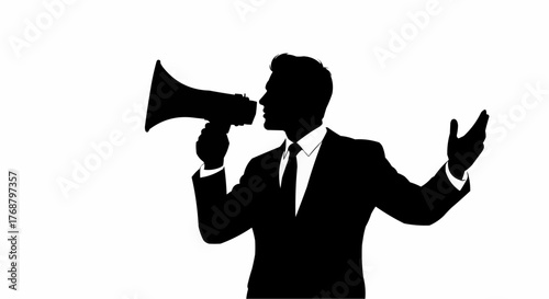 Silhouette of a man in a suit holding a megaphone and gesturing with his hand on a white backdrop