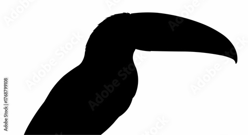 Silhouette of a toucan bird with its large beak prominently displayed against a white background space