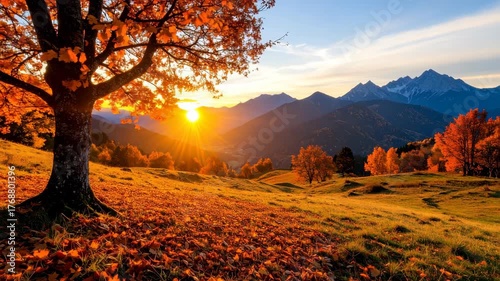 Scenic autumn landscape with golden leaves, mountain peaks and sunset sunlight, rural environment on grassy hillside.