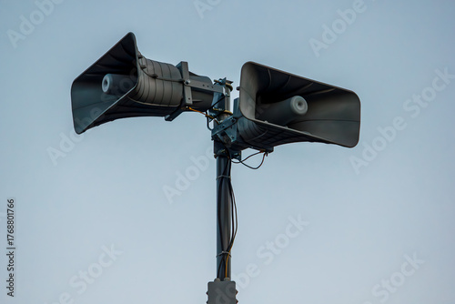 Air raid warning loudspeaker system on metal pole outdoors