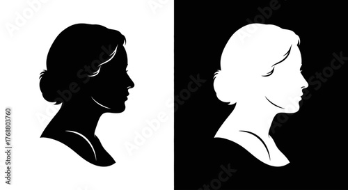 Classic black and white profile silhouettes of a woman's head with an elegant updo hairstyle.