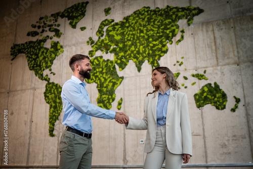 Business partners shaking hands on global deal