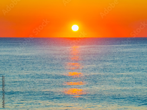 Orange Horizon: Sunrise by the Sea