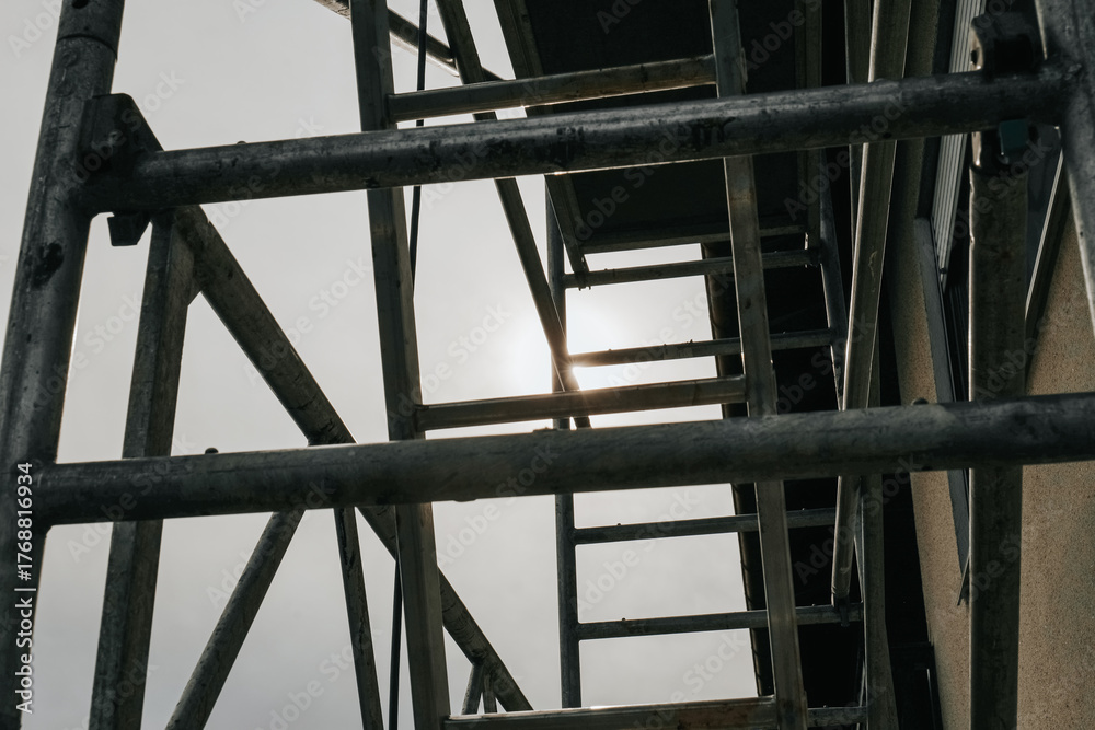 Fototapeta premium Construction Scaffolding Against Building Facade.Close-Up View of Scaffolding Against Building.