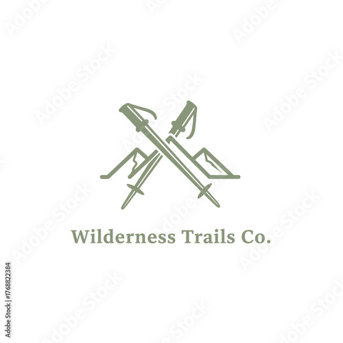 A logo design with crossed trekking poles and stylized mountains, in a muted green color