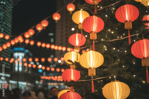 Vibrant red and yellow lanterns illuminate a nighttime street scene