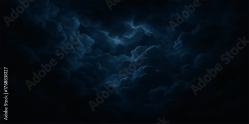 Dark blue sky background with stormy dark clouds and a hint of light