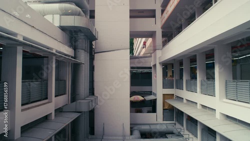 Brutalist Apartment Building in Singapore – High-rise architecture with laundry poles and geometric urban design.