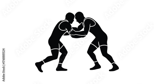 Two male wrestlers locked in a fierce grapple during a competitive match silhouette