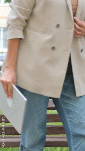 Old Senior Woman Closing Laptop and Leaving Park