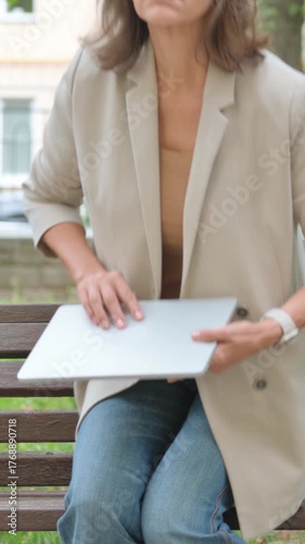 Old Senior Woman Coming, Sitting in Park to Use Laptop