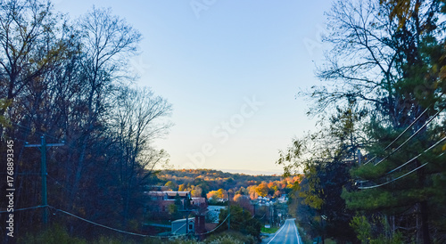 Scenic Autumn Road Leading to Small Town