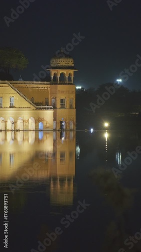 Jaipur, Rajasthan, India. Jal Mahal Or Water Palace In Night Illumination. Palace Inmiddle Of Man Sagar Lake. Reflections In Dark Water. Popular Tourist Attraction In Jaipur. Originally Constructed