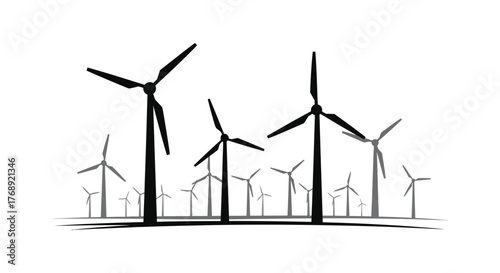 A group of wind turbines in a field creating clean renewable energy with a striking silhouette effect