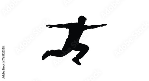 Dynamic silhouette of a man in mid air jump with arms outstretched in a playful pose silhouette