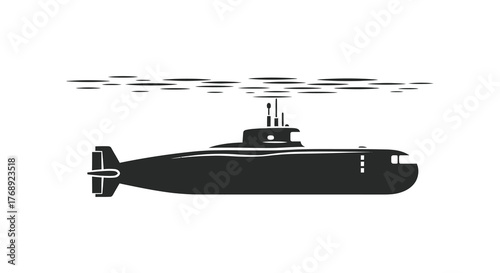 A dark silhouette of a submarine submerged just below the surface of the water with ripples above it