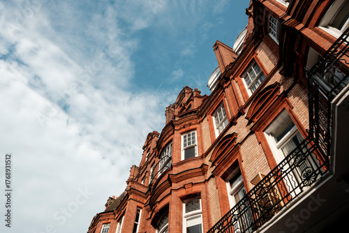 London red brick victorian architecture building under blue sky