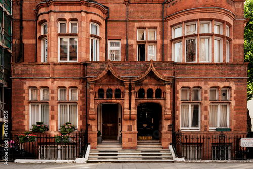 Victorian red brick townhouse facade in london