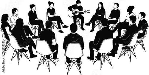 Diverse group of people gathered in a circle, listening to a person playing guitar and singing