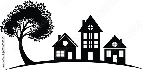 Charming silhouette of houses nestled beside a lush tree on a rolling hill.