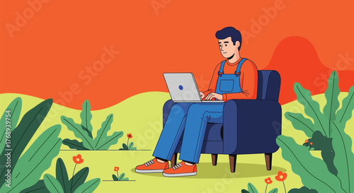 Young man focused on laptop while relaxing in armchair outdoors