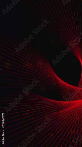 Red lasers create intricate patterns on a dark backdrop. Vertical video for social media post.