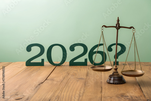 2026 Justice Concept with Balance Scale and Question Mark on Wooden Table
