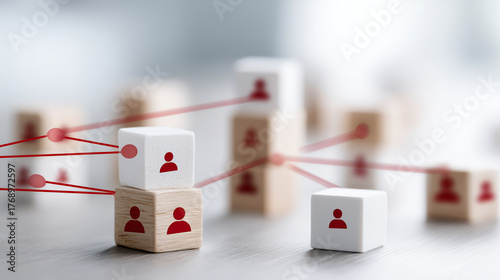 Human icons on blocks connected by red lines, organized business structure