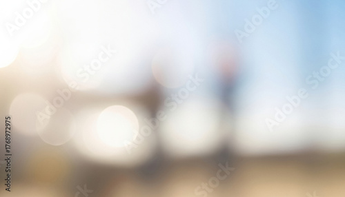 A bright abstract scene with gentle circular light patterns against a soft blue sky, blending airy tones and smooth gradients that evoke a peaceful and open visual feeling.