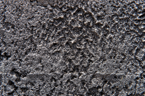 Obraz na płótnie Extreme close-up (macro) of a dark gray or black concrete wall