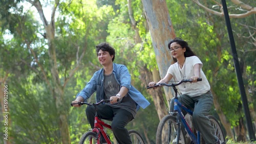 young couple riding bikes