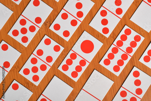 Domino card on wooden table background
